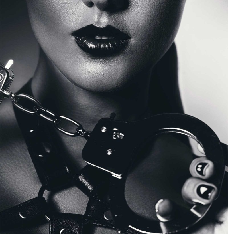 woman with BDSM hand cuffs