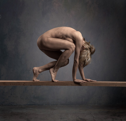 Woman on wooden board in studio